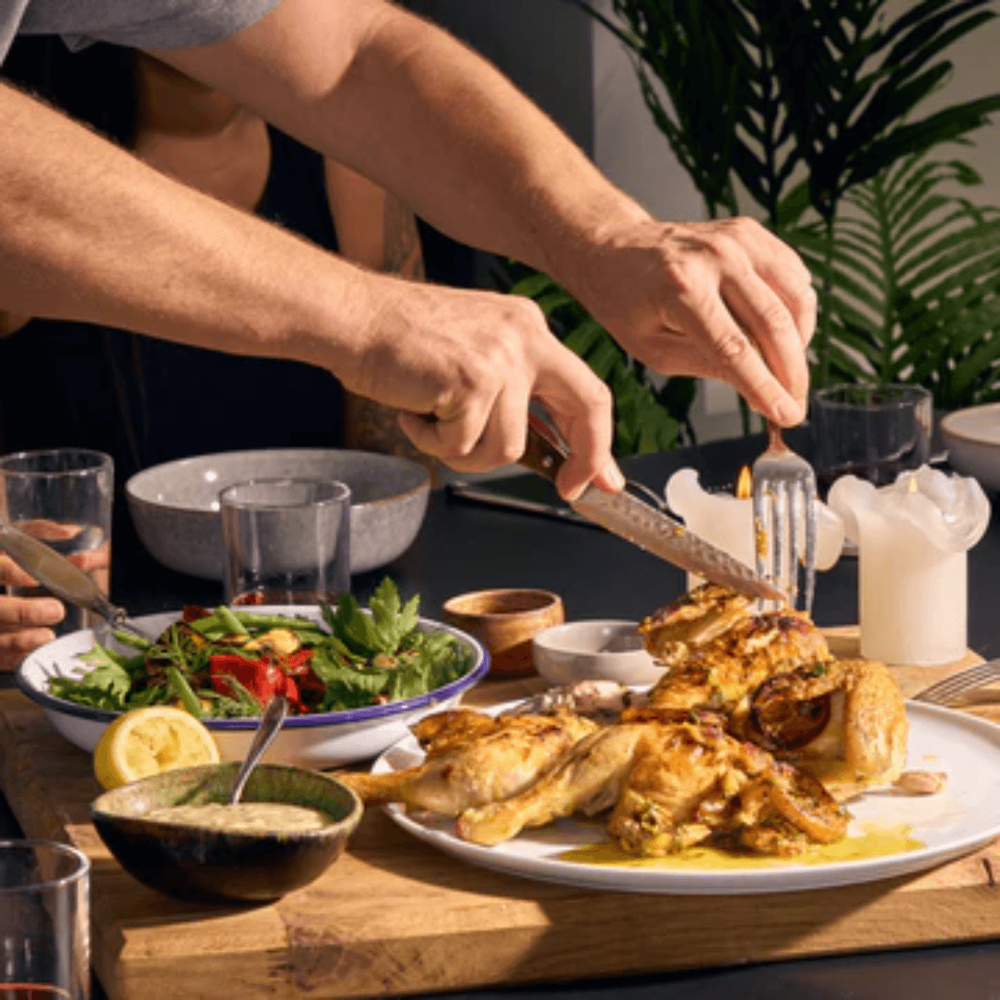 Roasted chicken served with sugar-free, seed oil-free mayonnaise dressing at a dinner table